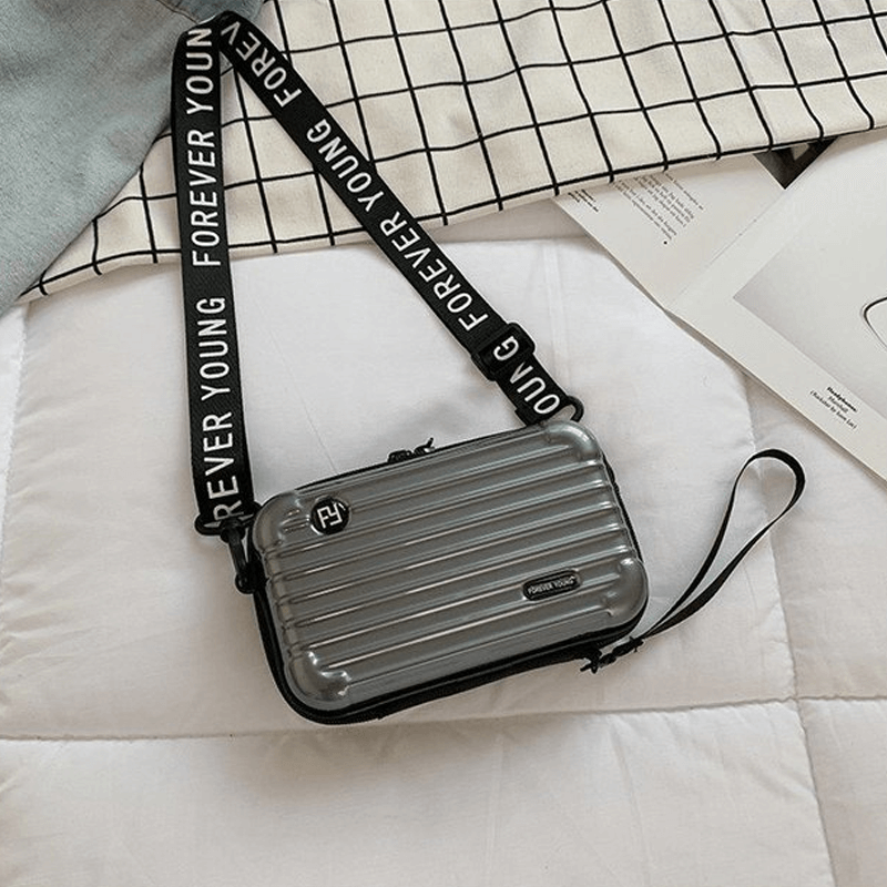 Resväska-inspirerad crossbody-väska